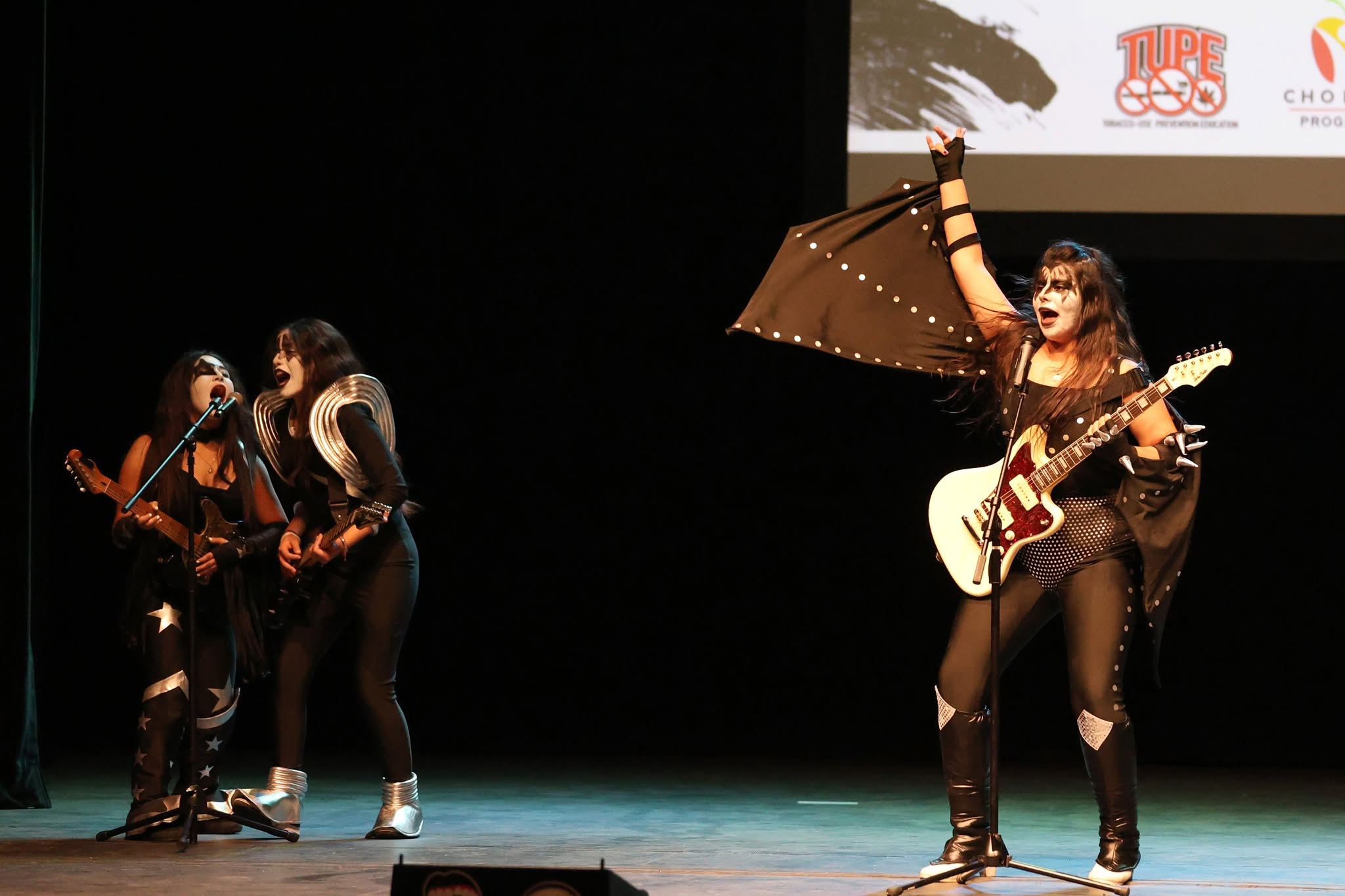 Students dressed up as a rock and roll band performing at the lip sync event.