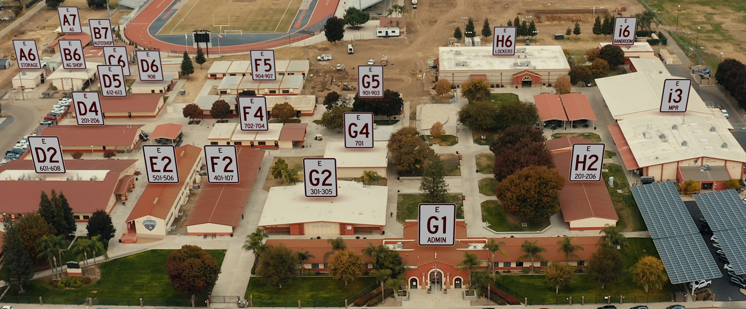Drone footage of school campus with ActVnet building identification numbers superimposed. 