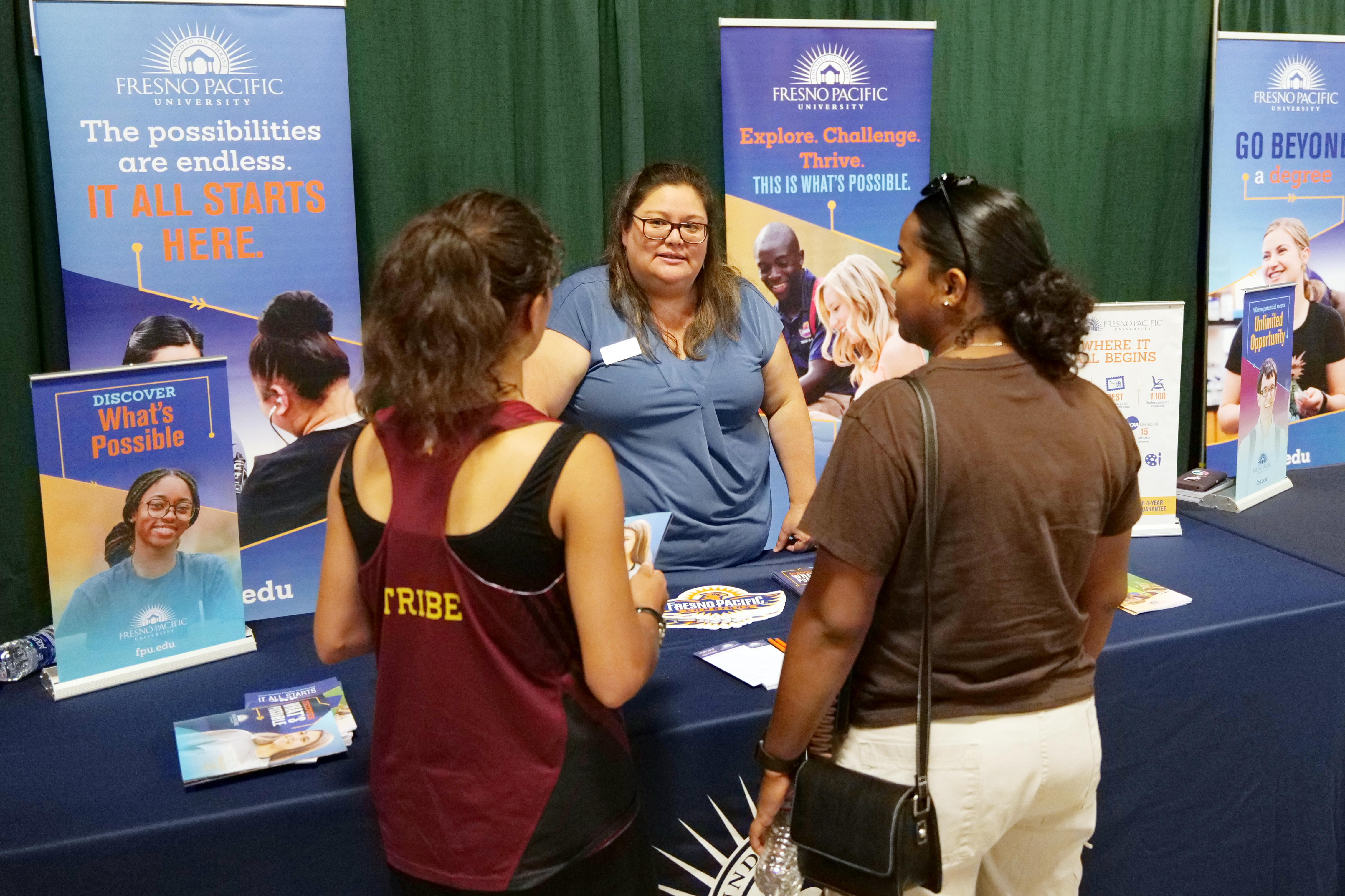 Family at College Night booth